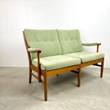 Two-seater sofa from the sixties with green upholstery