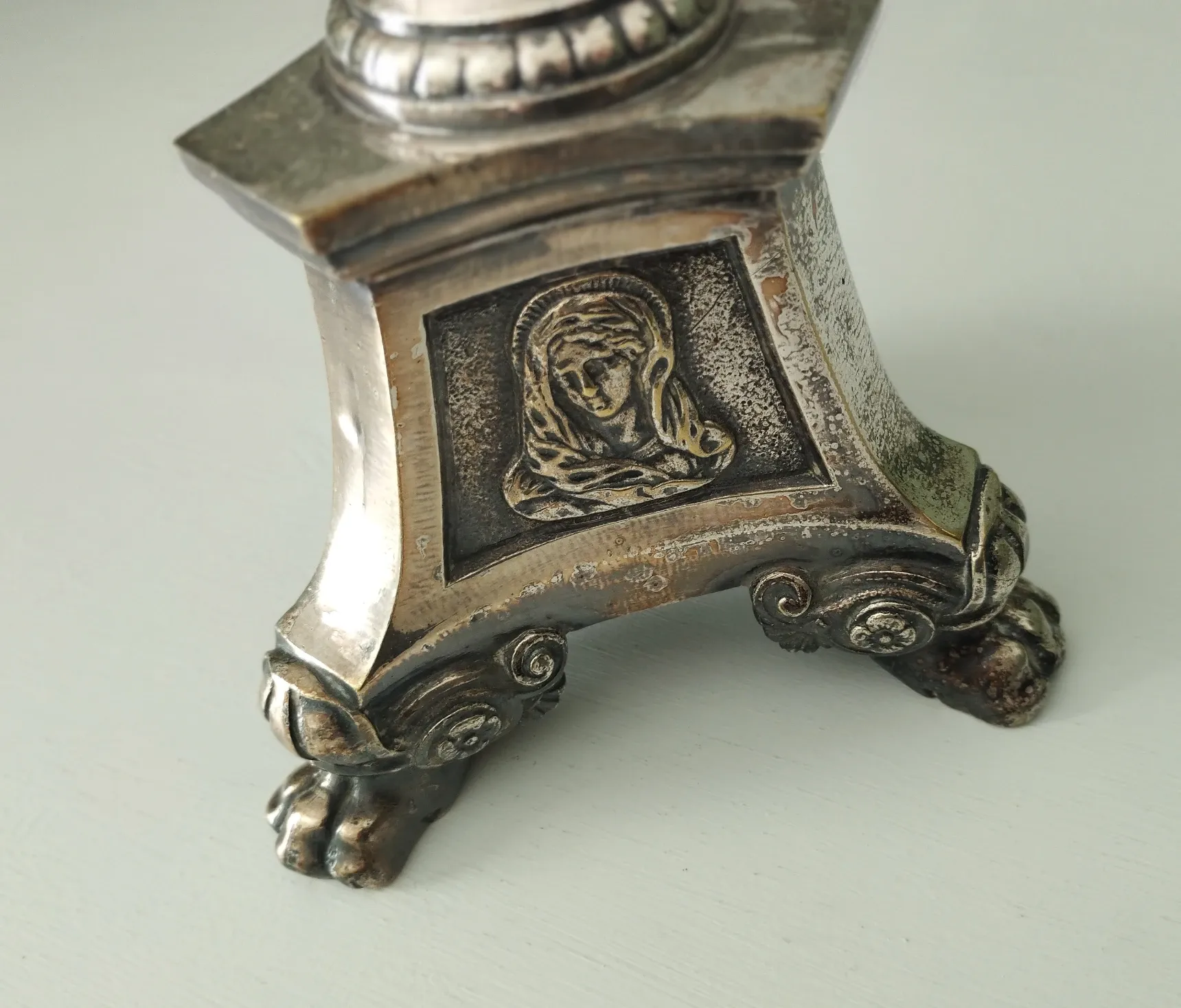 Old church candlestick in silver-plated metal