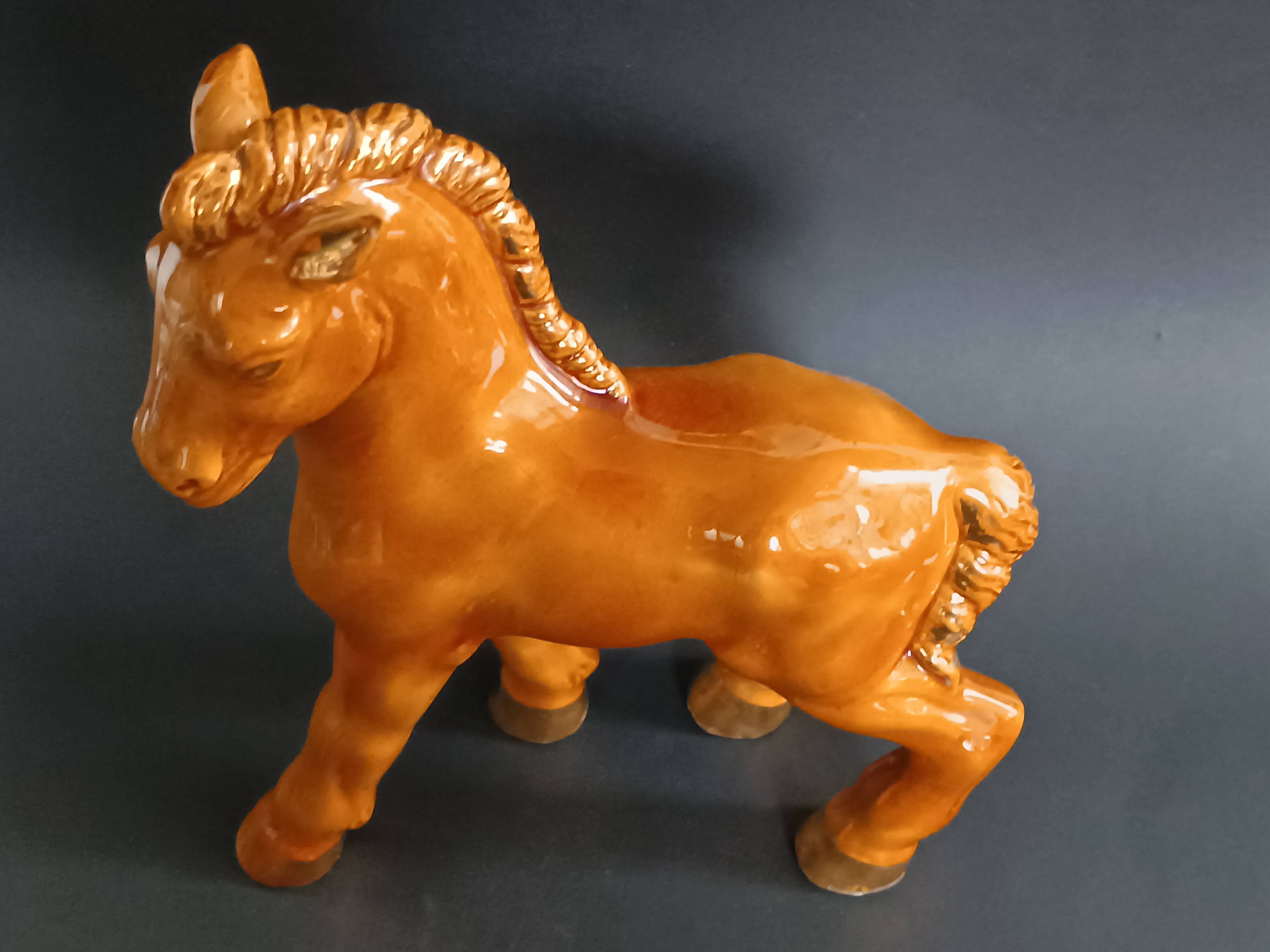 Ceramic horse sculpture with wild glaze and gold, signed Art Deco.