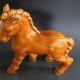 Ceramic horse sculpture with wild glaze and gold, signed Art Deco.