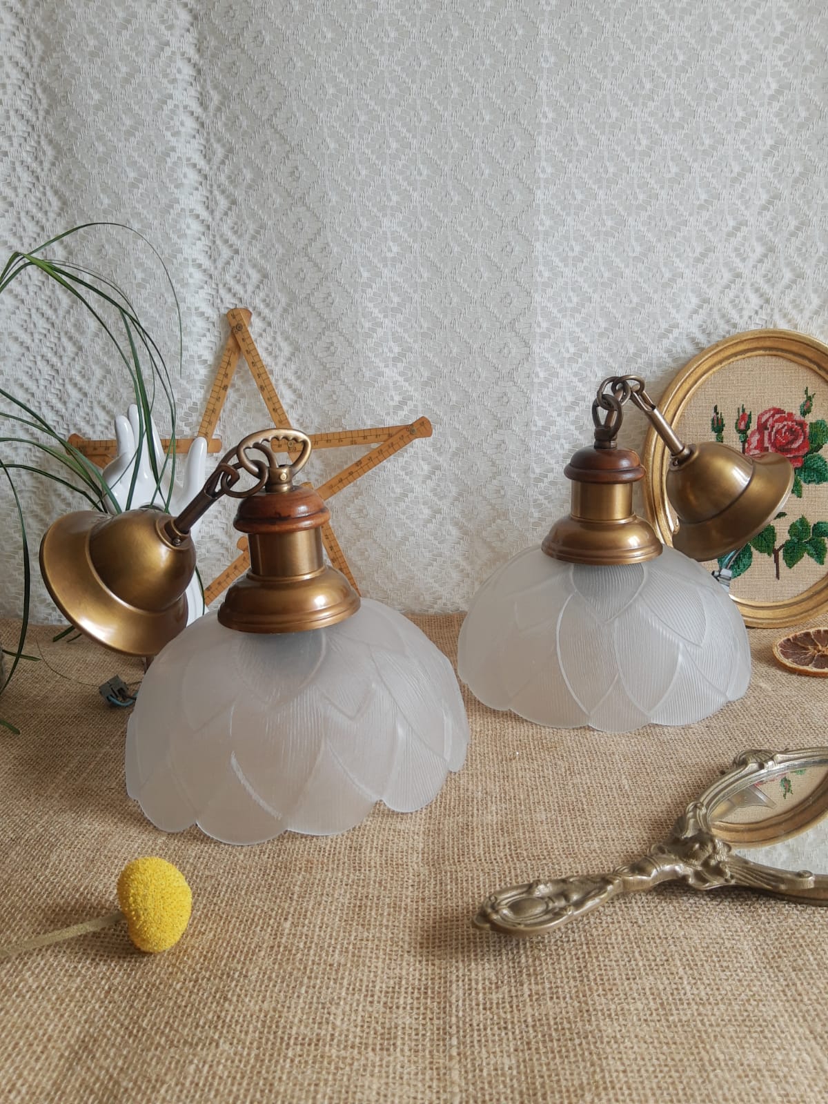 Pair of frosted glass flower pendant lights with vintage wood and brass