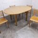 Danish ensemble transformable table 114 cm / 154 + 4 modernist chairs from the 1970s.