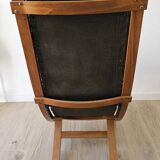 Scandinavian armchair in wood and leather.