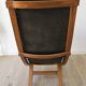 Scandinavian armchair in wood and leather.