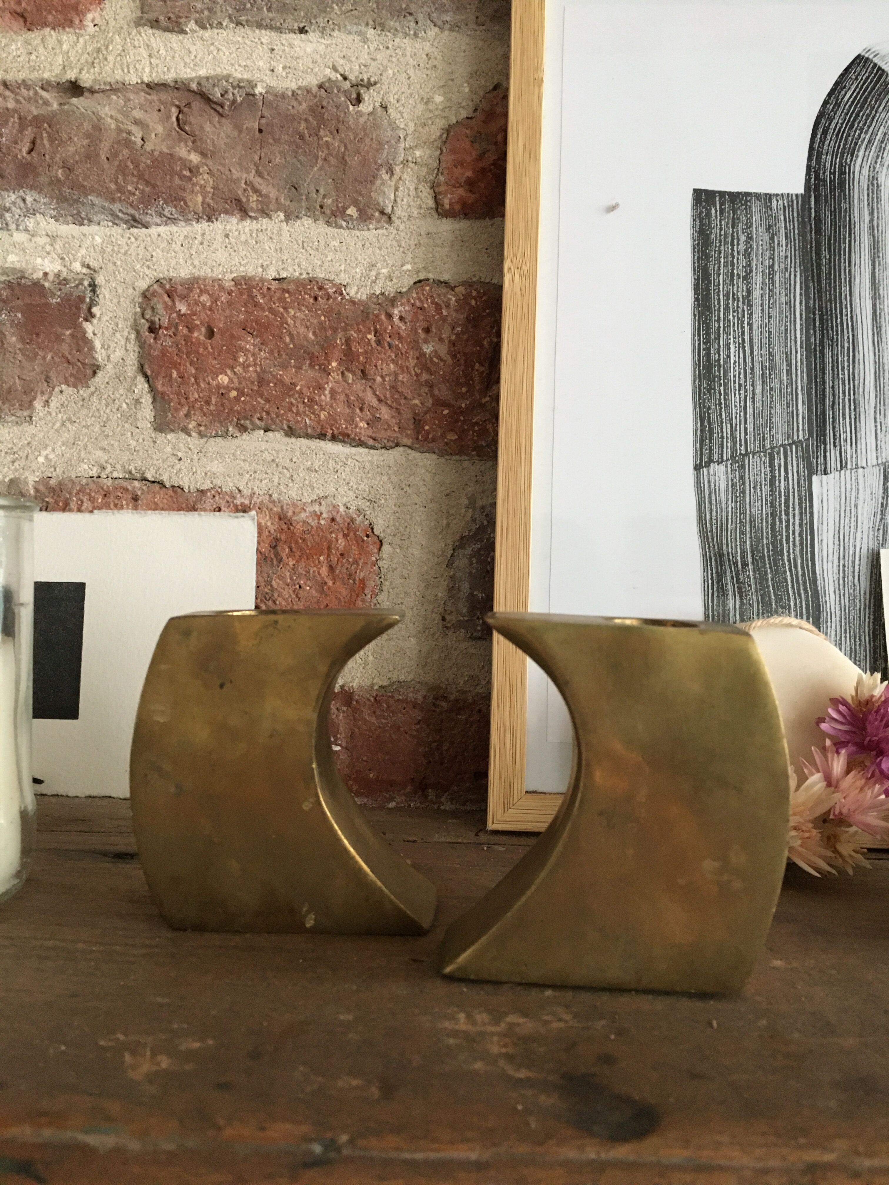 Pair of bronze candle holders by Monique Gerber