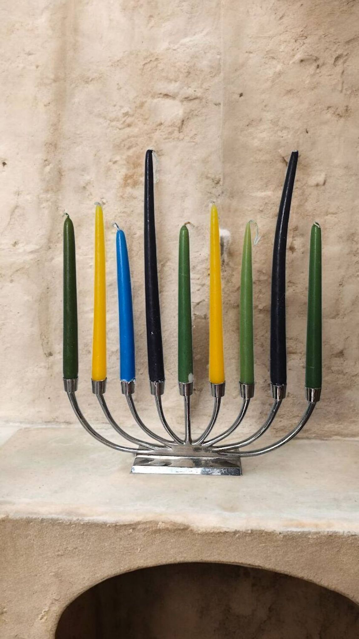 Large modern chrome metal candlestick for Hanukkah.