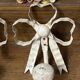 Metal and wood bow and ribbon hooks