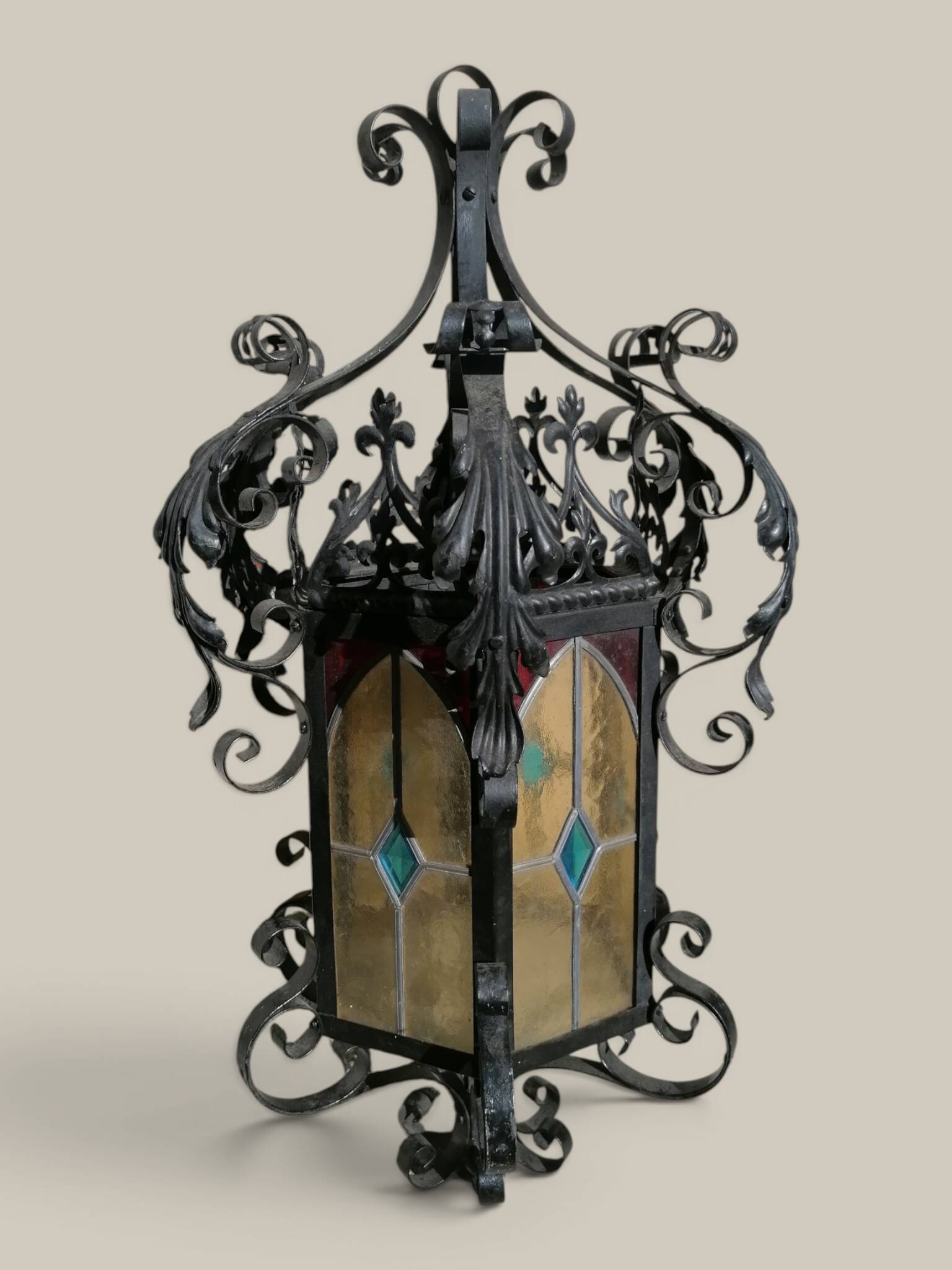 Black wrought iron lantern with stained glass. Medieval, Gothic decoration.