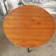 Round coffee table in walnut veneer and metal