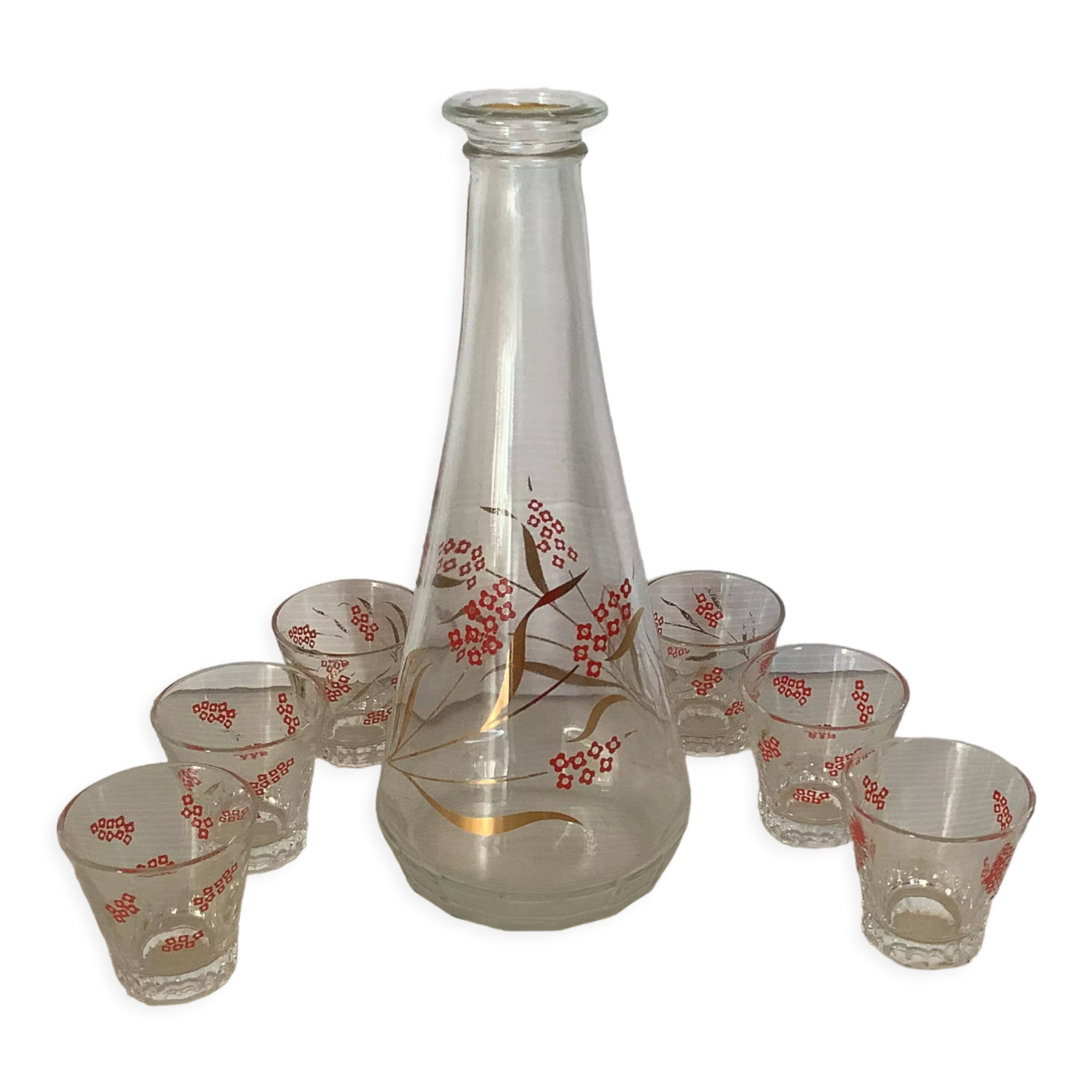 Carafe and 6 matching glasses in red and gold.