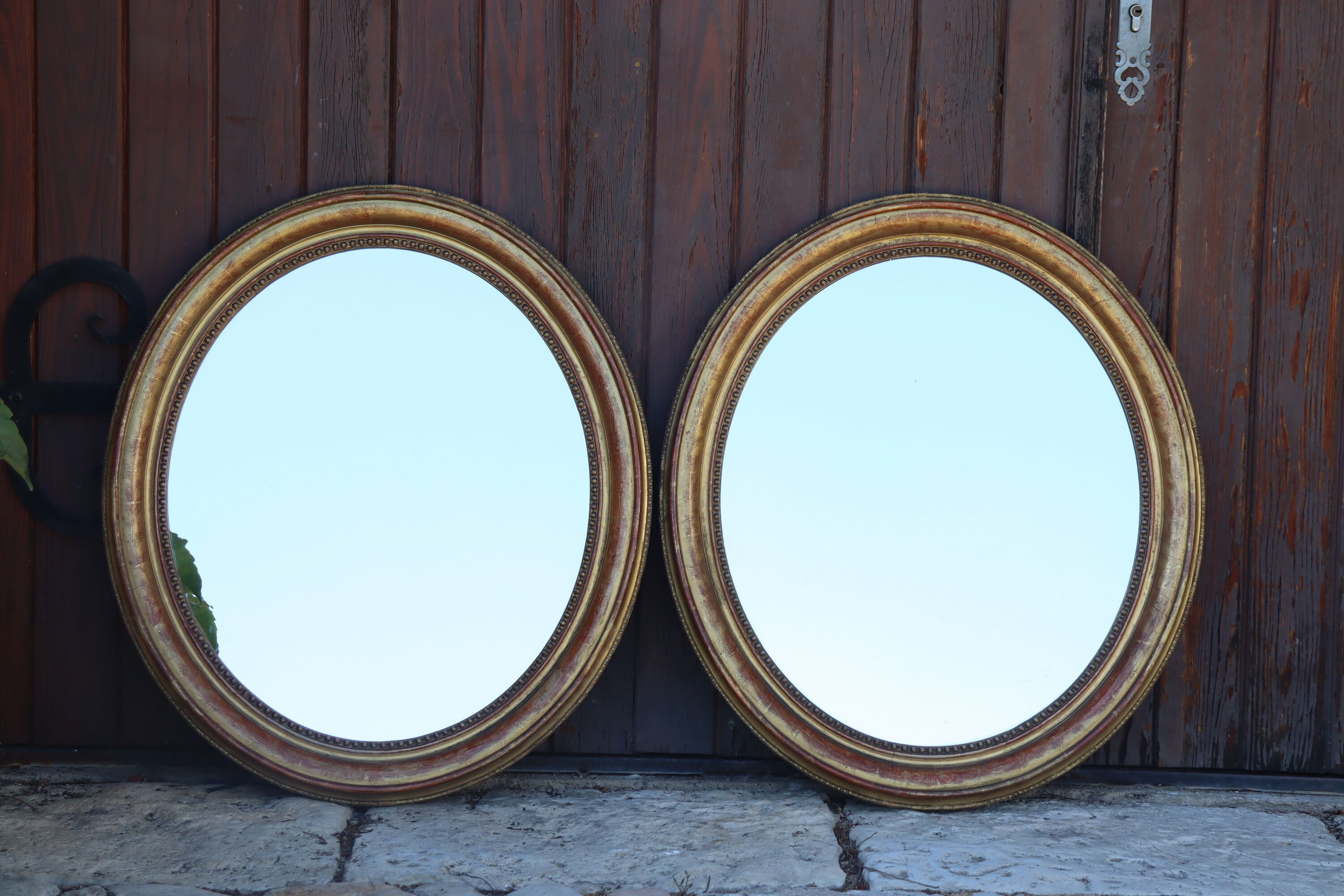 Pair of oval mirrors from the Louis Philippe period in gilded wood.