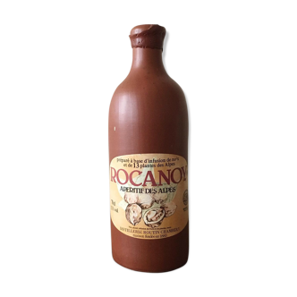 Old bottle in hazelnut Brown sandstone with label