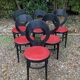 6 vintage Baumann seagull model chairs, black lacquered with red Skai seats.