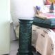 Pedestal column in green ceramic with flower and fruit decoration