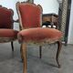 Louis XV style salon in carved walnut with orange velvet, seven pieces.