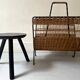 Porte revue en fer forgé noir et rotin dlg Raoul Guys, 1950