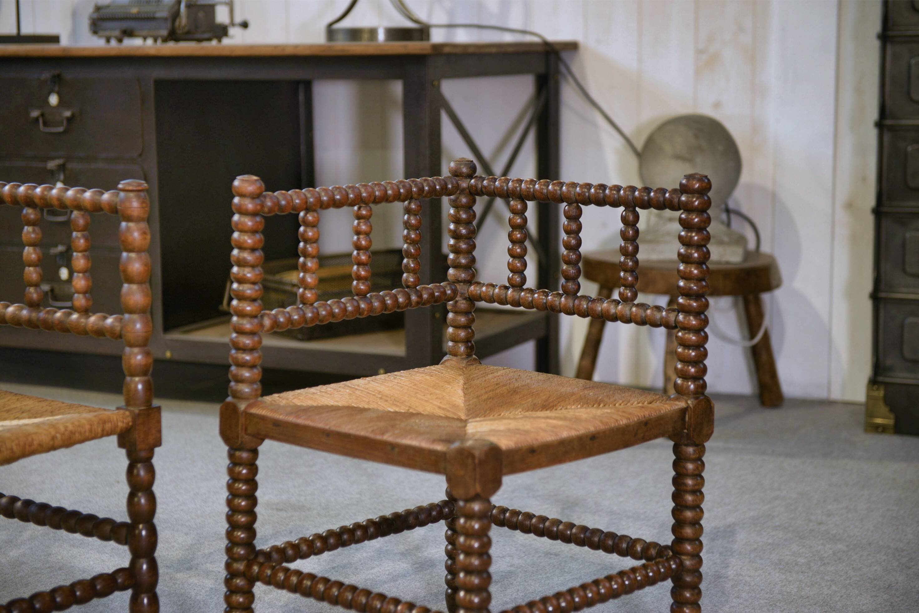 Pair of turned wooden corner chairs from the 1950s.