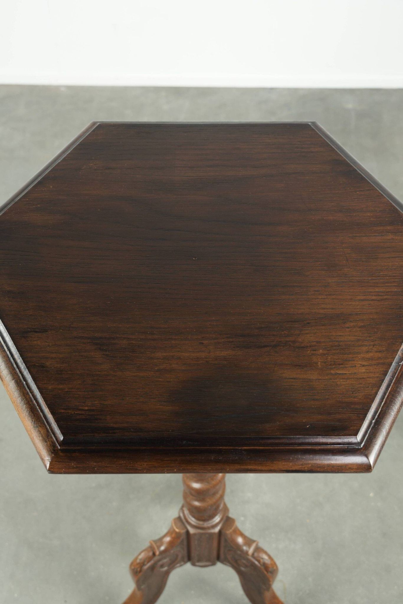Antique tall oak plant/side table with wood carving and a turned leg