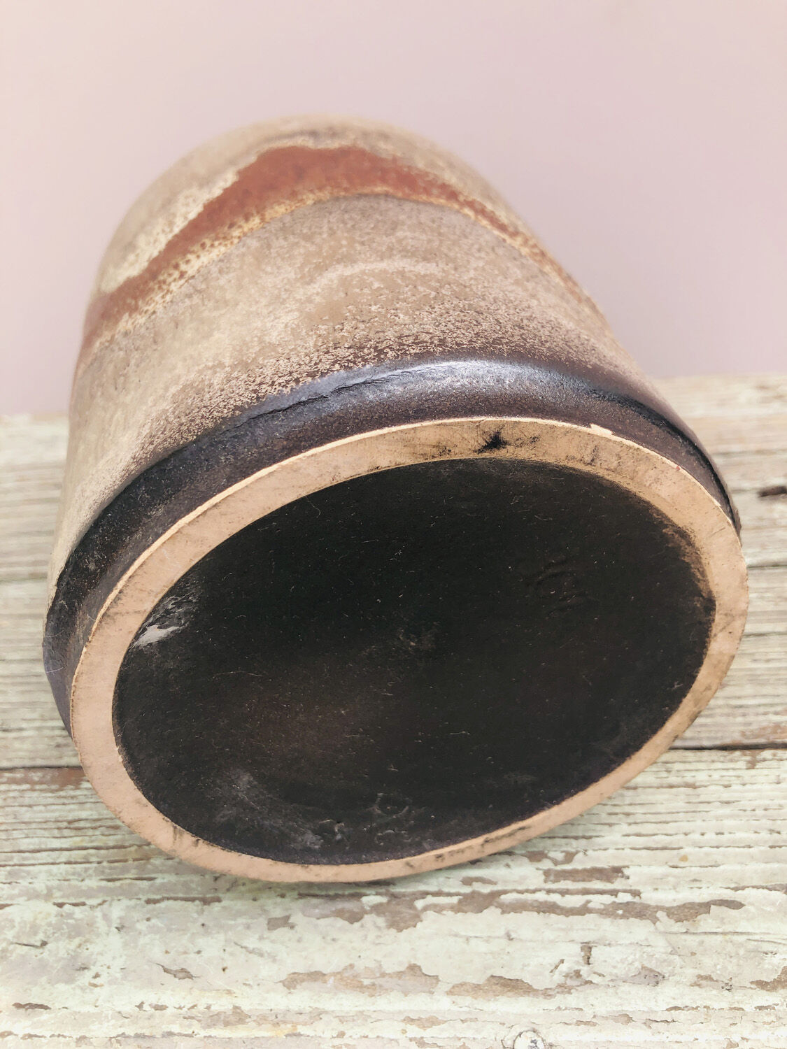 Ancient sided jug in flamed sandstone