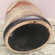 Ancient sided jug in flamed sandstone