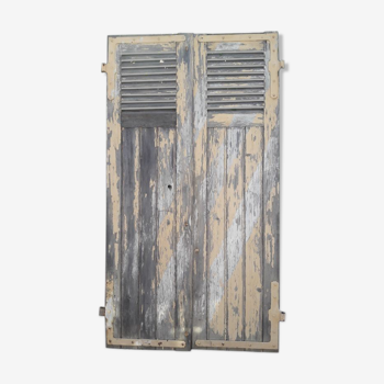 Pair of old shutters with louvers