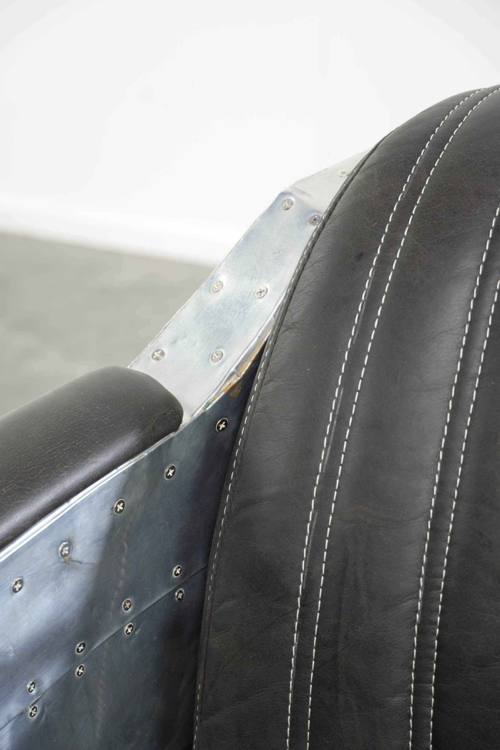 Set of 2 sturdy industrial black cowhide Aviator design armchairs with aluminium and rivets