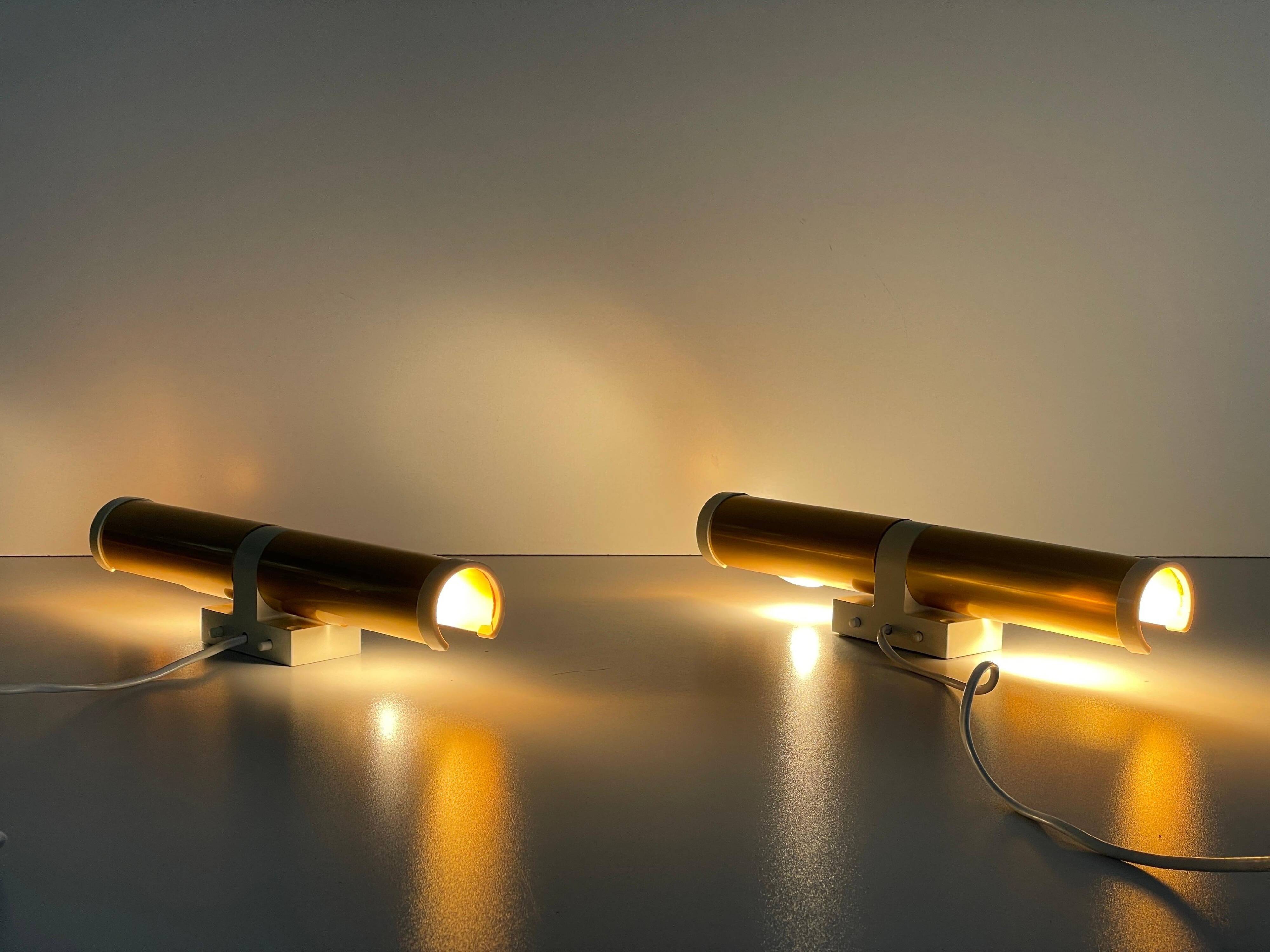 Pair of two-headed wall sconces in gold metal by ERCO, 1970s, Germany