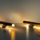 Pair of two-headed wall sconces in gold metal by ERCO, 1970s, Germany