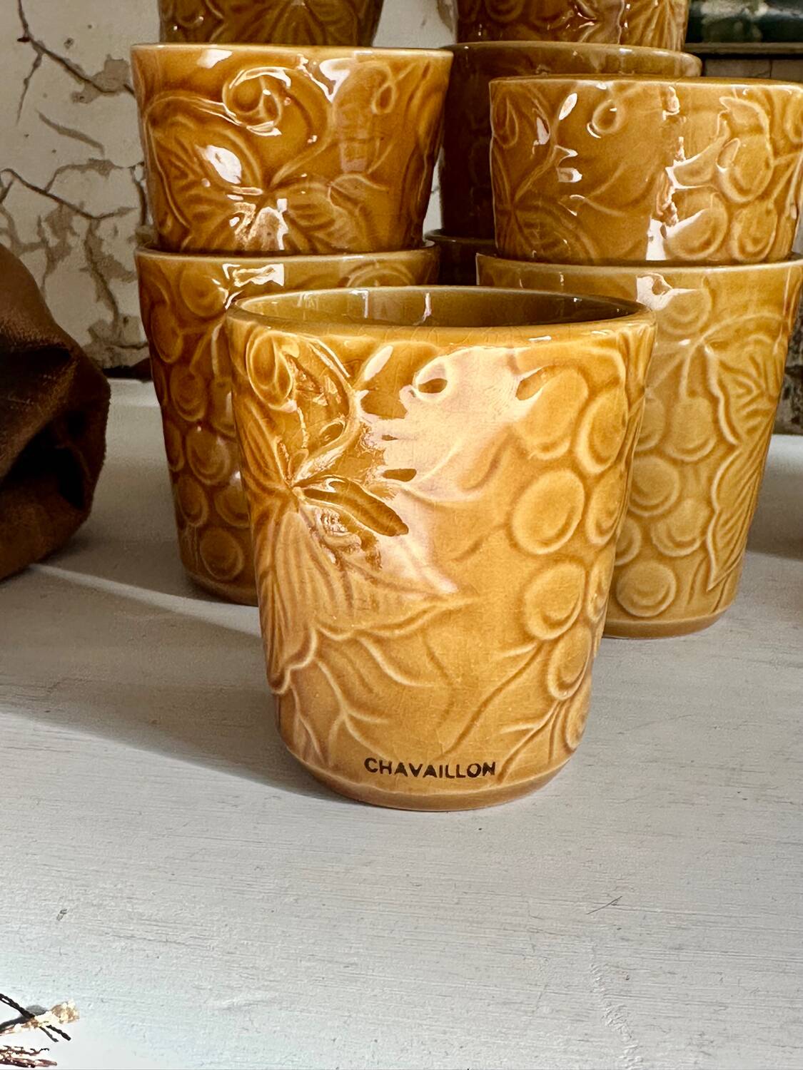 Set of 12 ochre Chavaillon de Sarreguemines cups