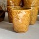 Set of 12 ochre Chavaillon de Sarreguemines cups