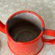 Vintage red enamelled tin teapot