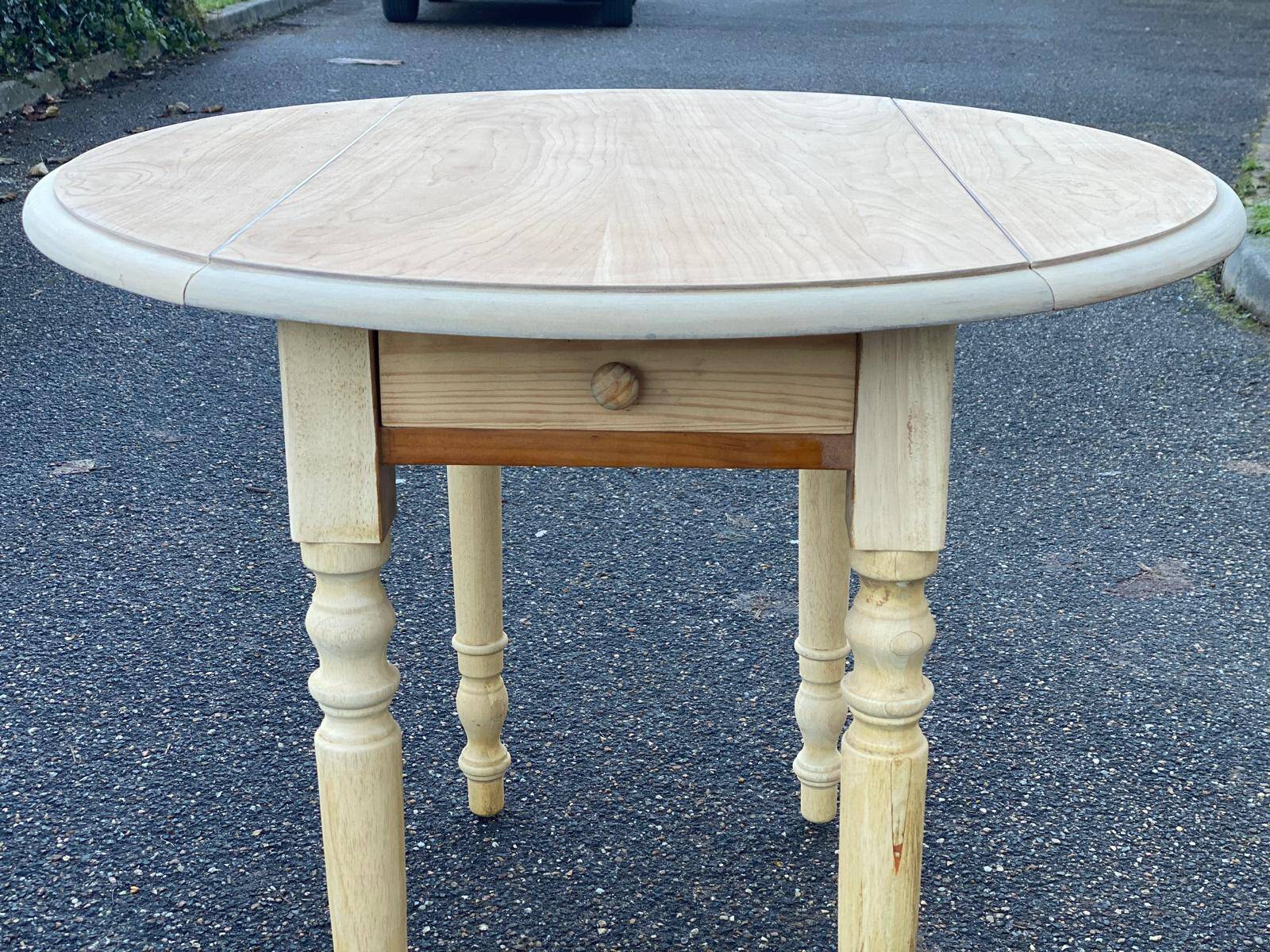 Round table with flaps or shutters renovated in raw solid wood