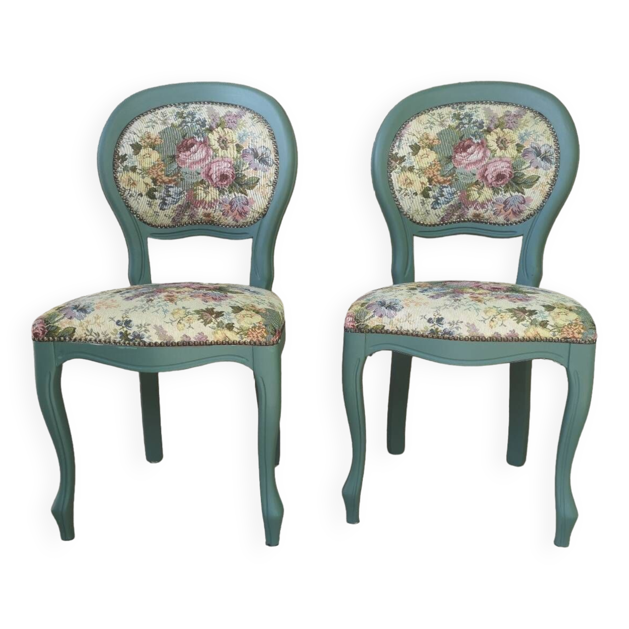 Antique chairs with studded upholstery.