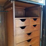 Old black wardrobe - wooden drawers and labels of origin