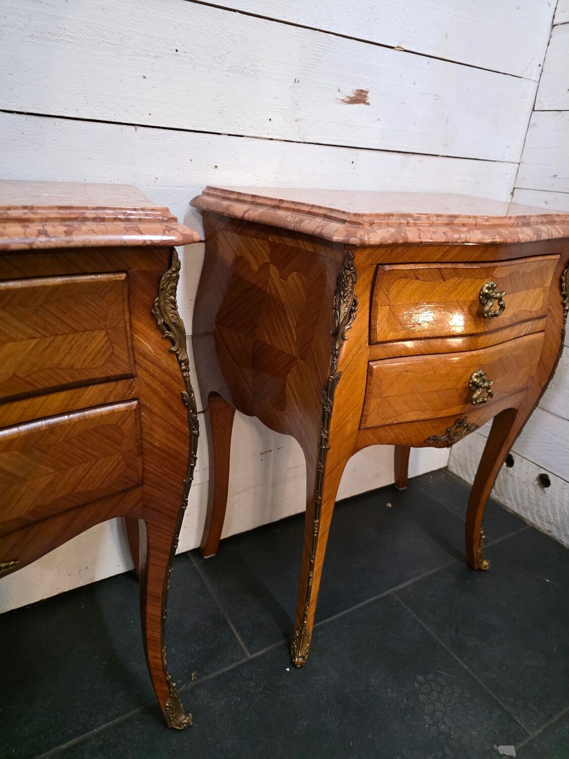 Pair of Louis XV style curved bedside tables in marquetry
