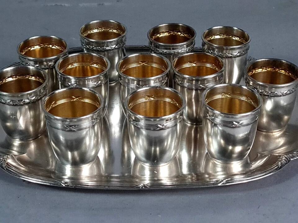 Antique silver-plated/gold liquor service with 12 goblets, tray + case.
