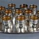 Antique silver-plated/gold liquor service with 12 goblets, tray + case.