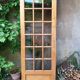 Old wooden door glazed with small tiles