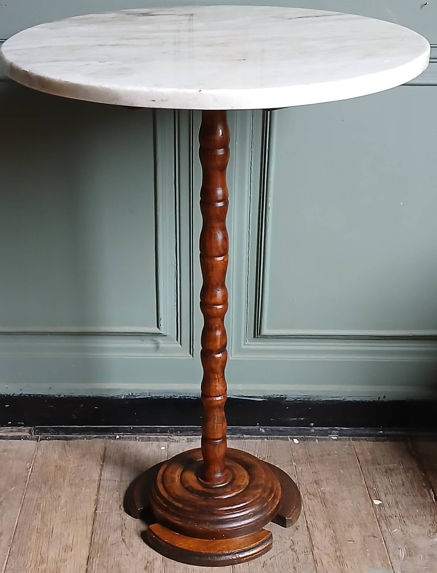 Turned solid wood side table stained with a quartz top.