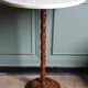 Turned solid wood side table stained with a quartz top.