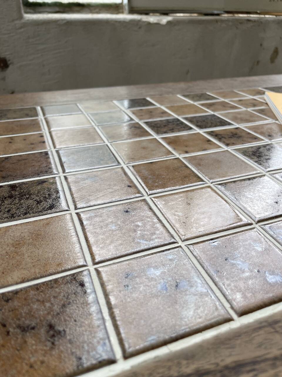 Set of two bistro tables in walnut and tiling from 1890.