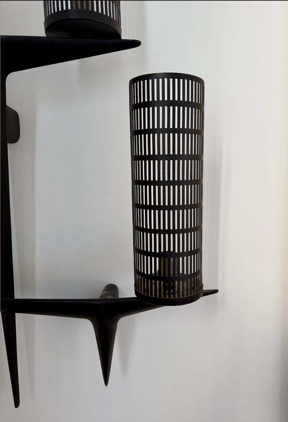 Pair of sculpted lacquered bronze wall lights, Arlus