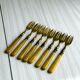 Set of 8 vintage gold metal dessert forks