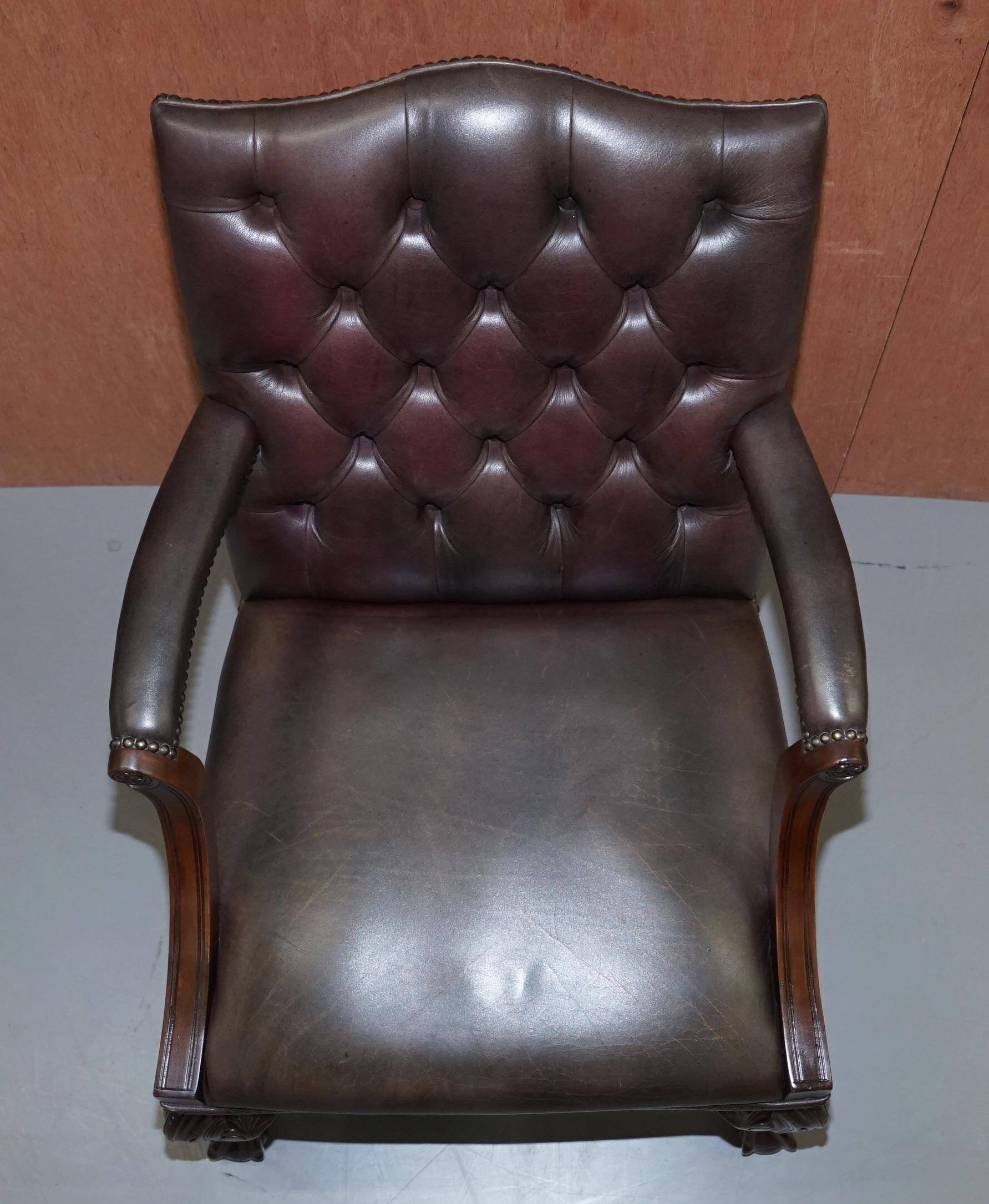 Gainsborough armchair George II leather Chesterfield hand-carved with claw and ball feet.
