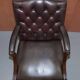 Gainsborough armchair George II leather Chesterfield hand-carved with claw and ball feet.