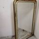 Antique mirror with a gilded frame and cherubs.