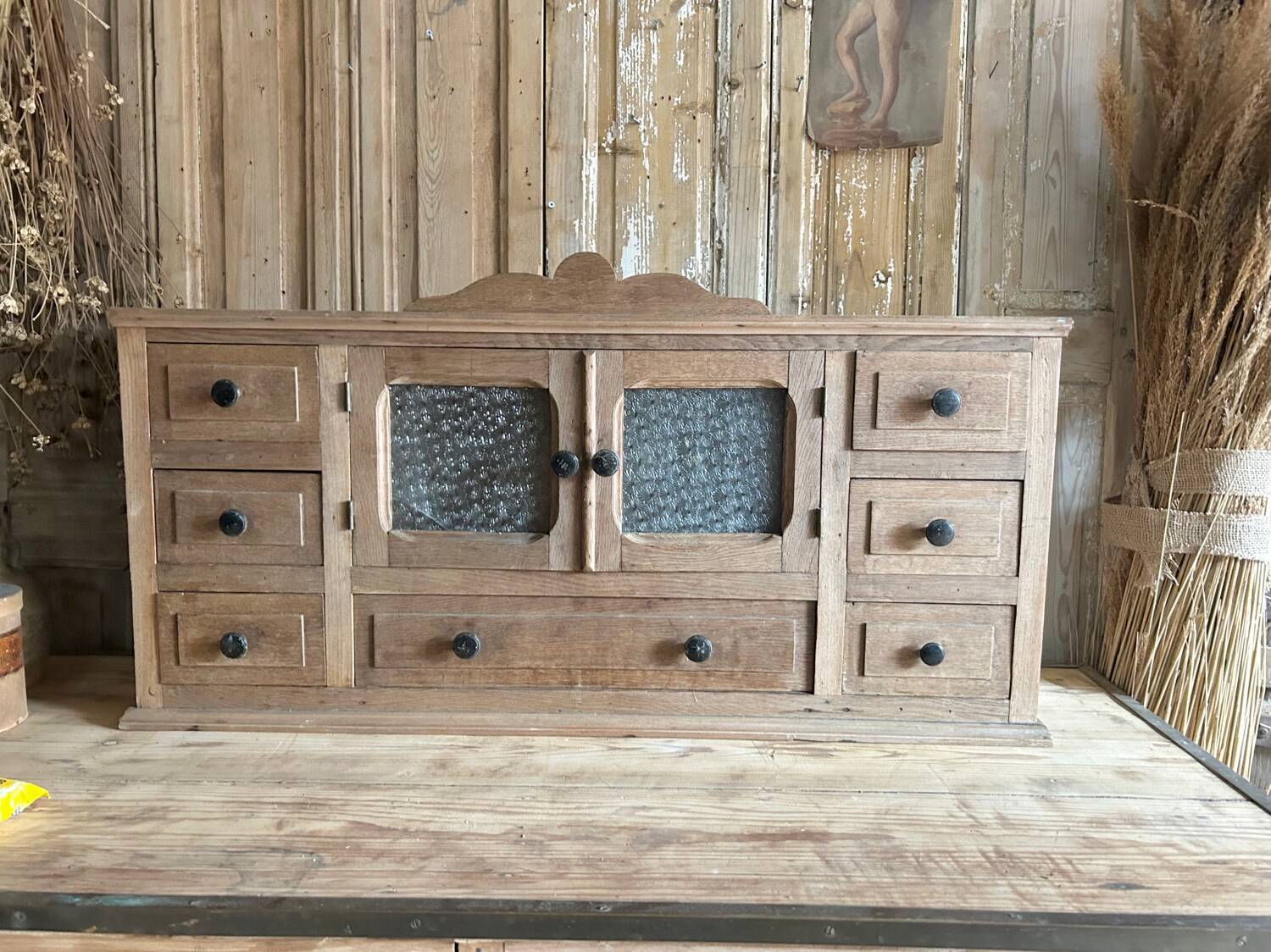 Small piece of furniture with glass doors and drawers
