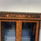 Napoleon III display cabinet in rosewood veneer and marquetry, 19th century.