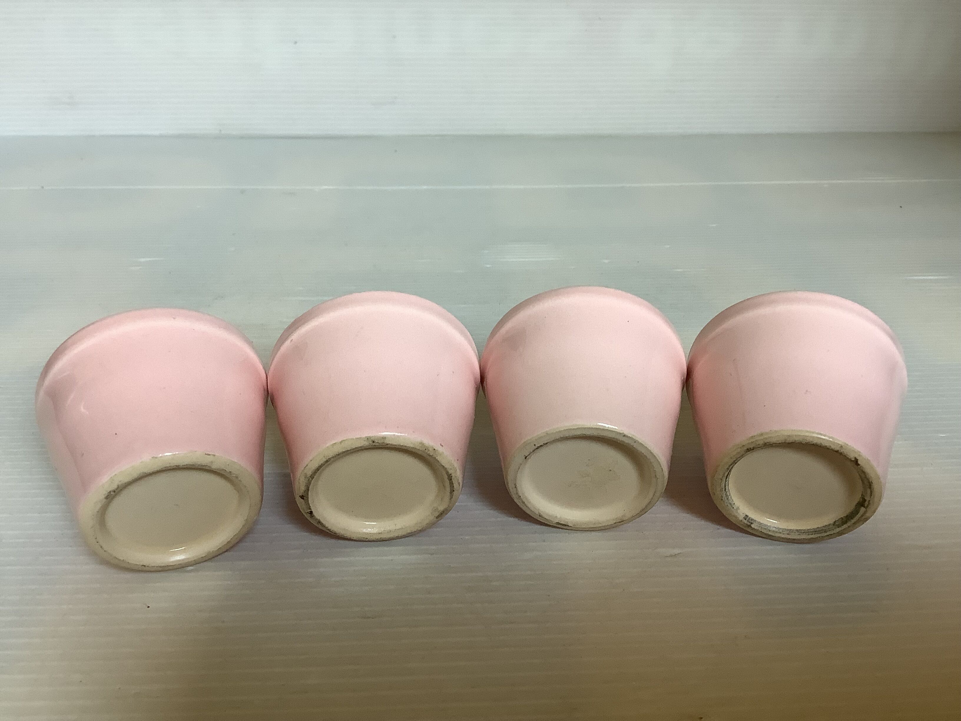 Four double pink candlesticks