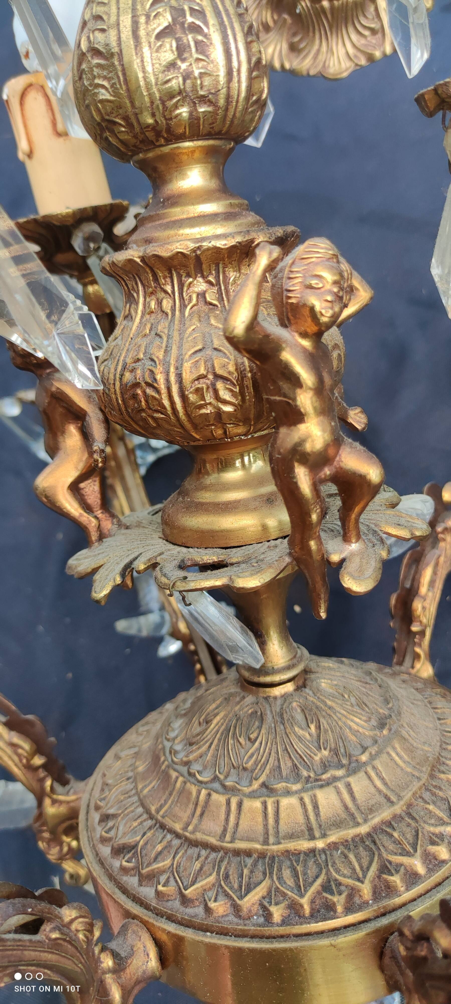 Old bronze chandelier/stamps and angel décor